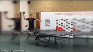 Javier Manquillo winds up as tries to smash the ping pong ball past Gavin Evans in the Instagram video